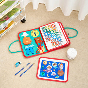 lifestyle product photos of montessori busy book opened on floor